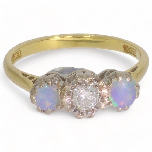 126 - A twentieth century three stone diamond and opal set dress ring
1 stone, Round brilliant cut. Colour... 