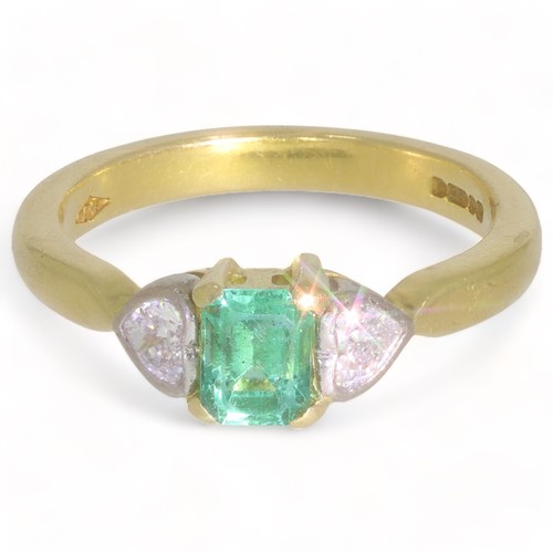 138 - A 18ct yellow and white gold three stone emerald and diamond set dress ring
1 stone. Emerald cut
Col... 