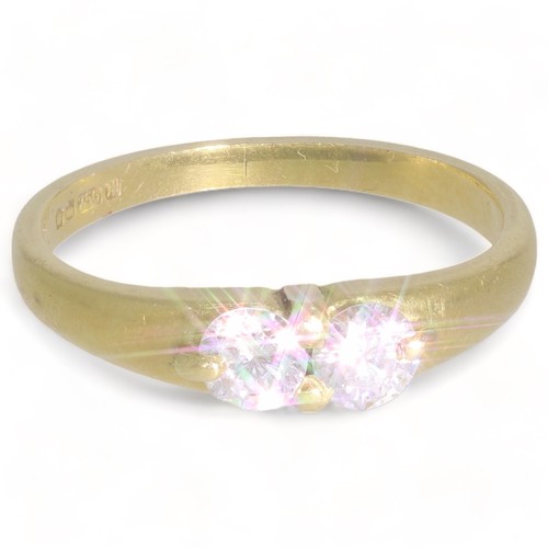 140 - A 18ct yellow gold two stone diamond set dress ring
2 stones, Round brilliant cut. Colour: H/l. Clar... 