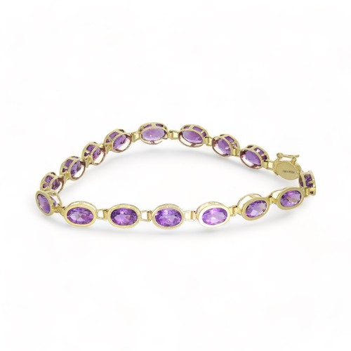 188 - An 18ct gold amethyst line bracelet. Hallmarks for London, 2022. Length 18cms. 6.9gms.