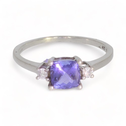 190 - A 9ct gold tanzanite and colourless gem three-stone ring