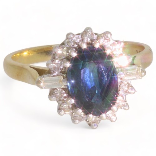 193 - A sapphire and vari-cut diamond cluster ring.
Sapphire calculated weight 2.05cts, based on estimated... 