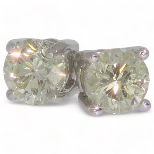 232 - A pair of very light fancy yellow diamond stud earrings
1 stone, Round brilliant cu.t Fancy colour: ... 