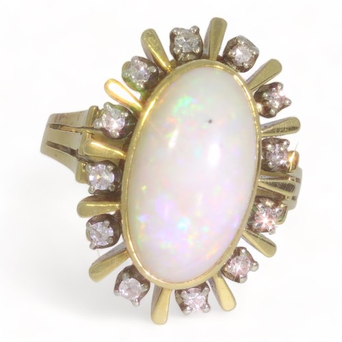 91 - An all yellow metal opal & diamond oval cluster ring.
The oval cabochon cut opal measures approx. 15... 