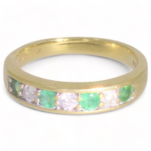 126 - A 18ct yellow gold emerald and diamond half eternity ring
4 stones, Circular faceted cut
Bulge: slig... 