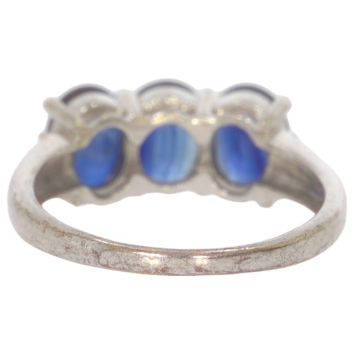 50 - 9ct gold diamond half eternity ring. Set three oval blue kyanite. Ring size N. Weight 3.59g. Hallmar... 