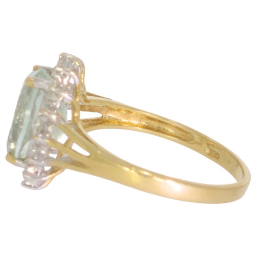 59 - 9ct gold green quartz and diamond cluster ring. Set with one oval green quartz, and eight cut diamon... 