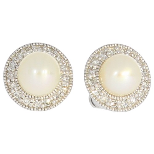 70 - 9ct white gold cultured pearl and diamond cluster earrings. two 5.2mm cultured saltwater pearls, and... 