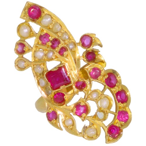 237 - Ornate gemstone ring.Set with synthetic rubies and seed pearls (likely cultured). Weight 4.89g. Unma... 