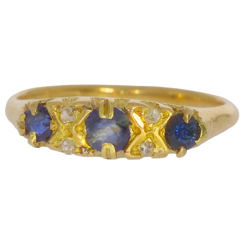 127 - Antique sapphire and diamond dress ring. Set with three medium blue sapphres, and rose cut diamonds ... 