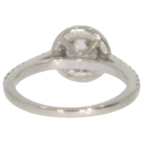 166 - Diamond halo cluster ring. Set with a principle brilliant cut diamond of 0.67ct calculated weight, a... 