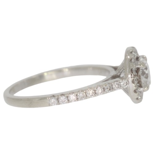 166 - Diamond halo cluster ring. Set with a principle brilliant cut diamond of 0.67ct calculated weight, a... 