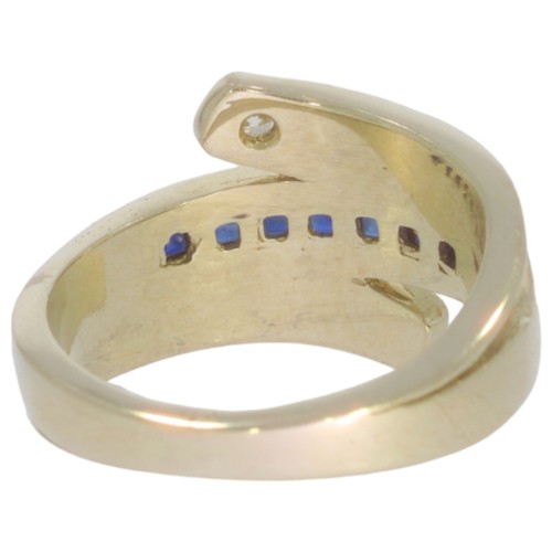 273 - Sapphire and diamond dress ring. Set with calibre cut sapphires, and a brilliant cut diamond of 0.08... 