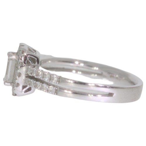 32 - 18ct white gold diamond halo cluster ring. Set with a principle brilliant cut diamond of 0.50ct calc... 