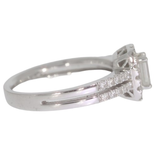 32 - 18ct white gold diamond halo cluster ring. Set with a principle brilliant cut diamond of 0.50ct calc... 