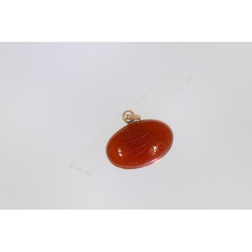 147 - Carnelian Aqeeq pendant. Set with an oval carnelian or Aqeeq, with inscription. Weight 1.5g. Unmarke... 