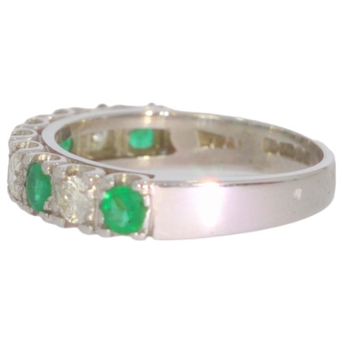 36 - 18ct white gold emerald and diamond half-eternity ring. Set with five vivid green emeralds, and bril... 