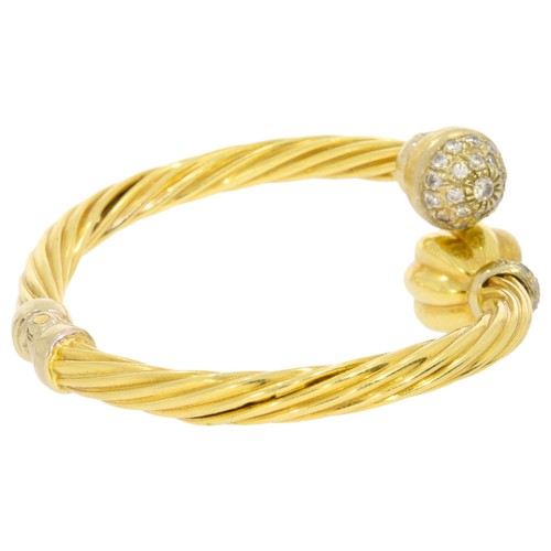 303 - Yellow Gold Marked '750' And CZ Bangle 47 CZ's Twisted Design 21.3 Grams