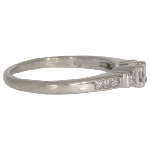 28 - 9ct white gold diamond three-stone ring. Set with princess cut diamonds of approximately 0.21ct tota... 