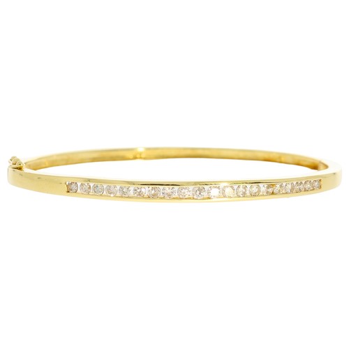 65 - Diamond  set bangle. Set with brilliant cut diamonds of 1.50ct total calculated weight, assessed as ... 