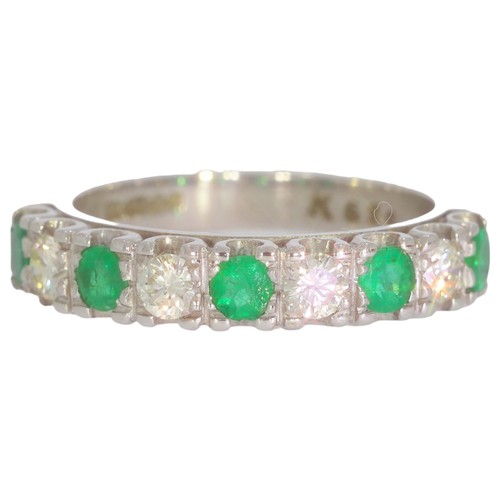 79 - 18ct white gold emerald and diamond half-eternity ring. Set with five vivid green emeralds, and bril... 