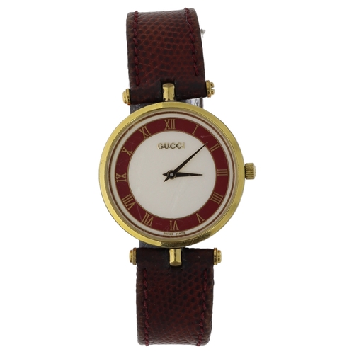 84 - Gucci 2000m Quartz 
Original Gucci Strap 
30mm
White Dial
Red and Green Outer Edge Of Edge