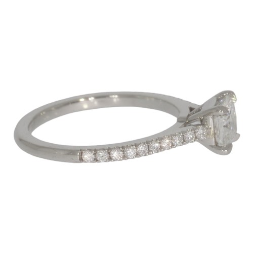 146 - Platinum diamond single-stone ring, with diamond shoulders.  Set with a principle radiant cut diamon... 