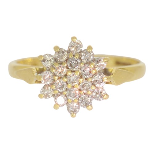 7 - 18ct gold diamond cluster ring. Set with brilliant cut diamonds of 0.50ct total calculated weight, a... 