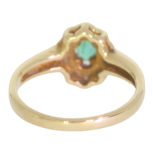 58 - 9ct gold emerald and diamond cluster ring. Set with an oval cut emerald, and brilliant cut diamonds ... 