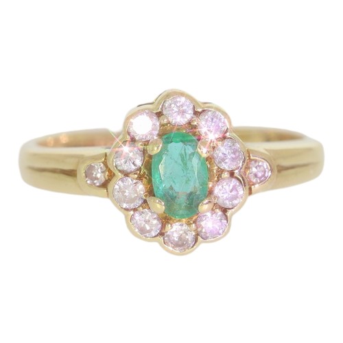 58 - 9ct gold emerald and diamond cluster ring. Set with an oval cut emerald, and brilliant cut diamonds ... 