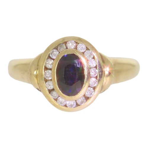 63 - 9ct gold sapphire and diamond cluster ring. Set with an oval cut sapphire, and brilliant cut diamond... 