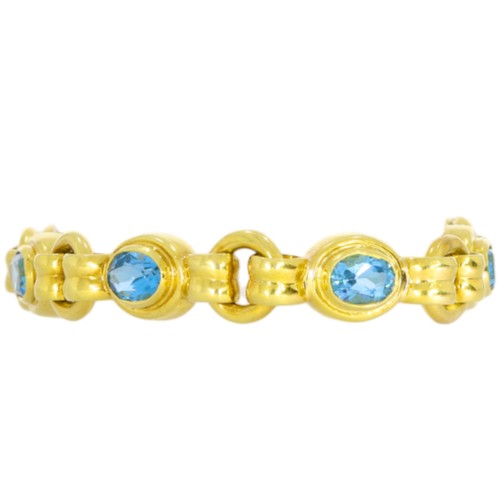 36 - 18ct yellow gold and blue stone bracelet.