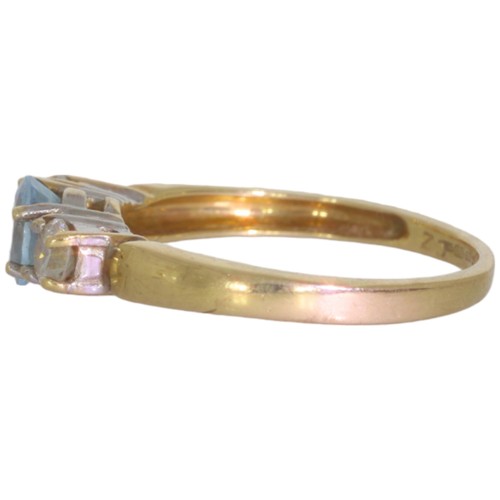 65 - 9ct gold topaz and CZ three stone ring. Set with an oval cut blue topaz, and CZ. Size M. Weight 2.2g... 