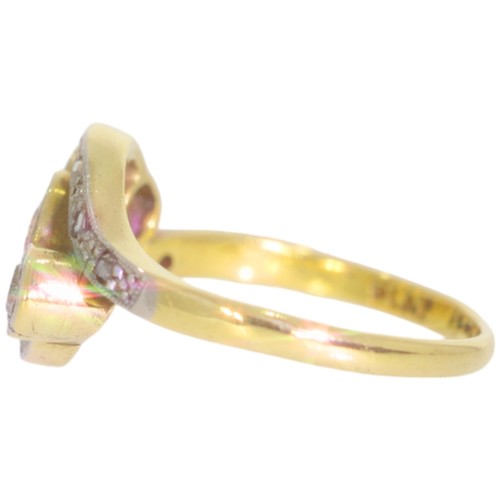 108 - A mid-twentieth century 18ct gold and platinum diamond three stone ring. Set with three brilliant cu... 