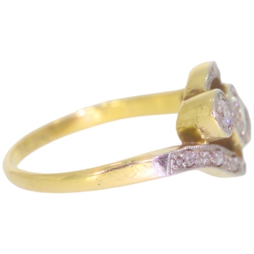 108 - A mid-twentieth century 18ct gold and platinum diamond three stone ring. Set with three brilliant cu... 