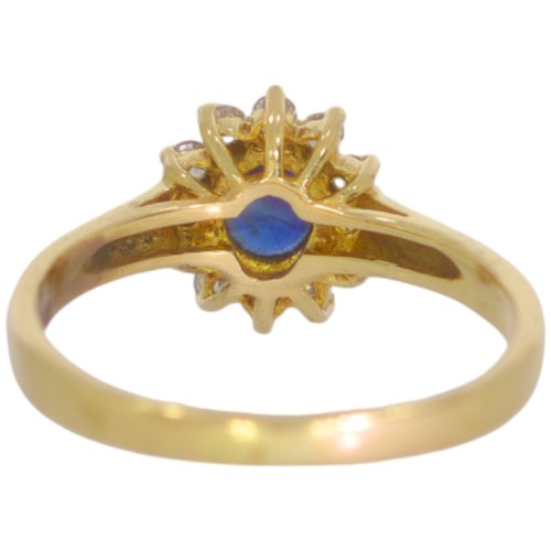 62 - 9ct gold sapphire and CZ ring. Set with an oval sapphire and CZ. Size J .Weight 2g. Tested as 9ct go... 