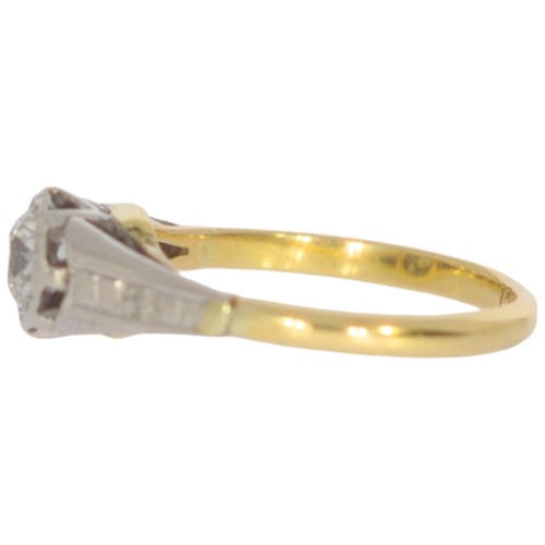 110 - A mid-twentieth century 18ct gold diamond three stone ring. Set with a principle old European cut di... 