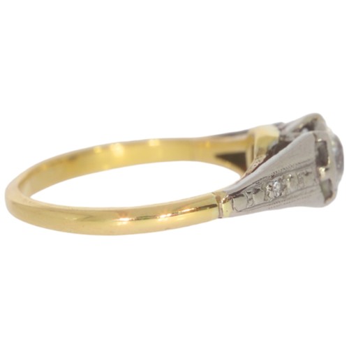 110 - A mid-twentieth century 18ct gold diamond three stone ring. Set with a principle old European cut di... 