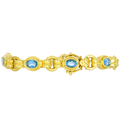 36 - 18ct yellow gold and blue stone bracelet.