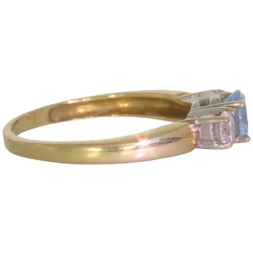 65 - 9ct gold topaz and CZ three stone ring. Set with an oval cut blue topaz, and CZ. Size M. Weight 2.2g... 