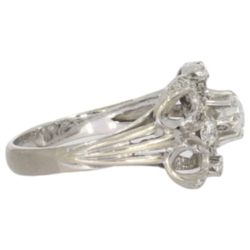 103 - A Diamond Set Dress Ring.
The Ring Mount Has Been Assessed As 18ct White Gold. 
1 Stone, Round Brill... 