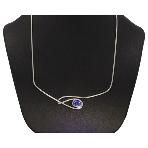 122 - An 18ct white gold tanzanite necklace. Set with an oval Tanzanite. Length 16