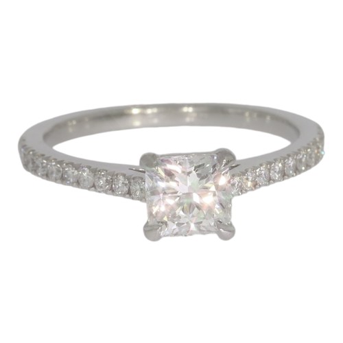 146 - Platinum diamond single-stone ring, with diamond shoulders.  Set with a principle radiant cut diamon... 