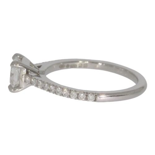 146 - Platinum diamond single-stone ring, with diamond shoulders.  Set with a principle radiant cut diamon... 