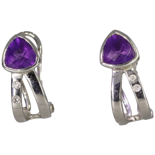 127 - 18ct White Gold Amethyst And Diamond Earrings 4.4 Grams. Set with trillion cut amethysts, and brilli... 