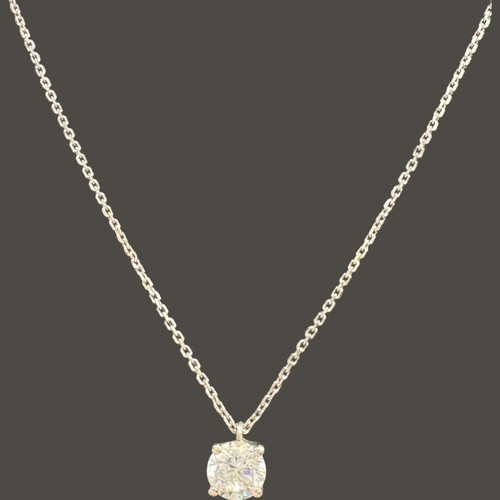 130 - 18ct white gold CZ pendant and chain. Chain length 16