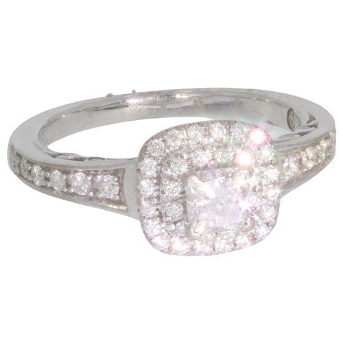 134 - 18ct white gold diamond halo cluster ring. Set with a principle brilliant cut diamond of 0.20ct calc... 