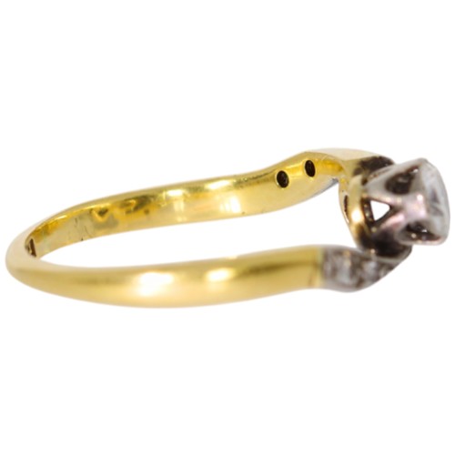 150 - 18ct yellow gold and platinum two-stone ring with diamond set shoulders. Set with a principle diamon... 