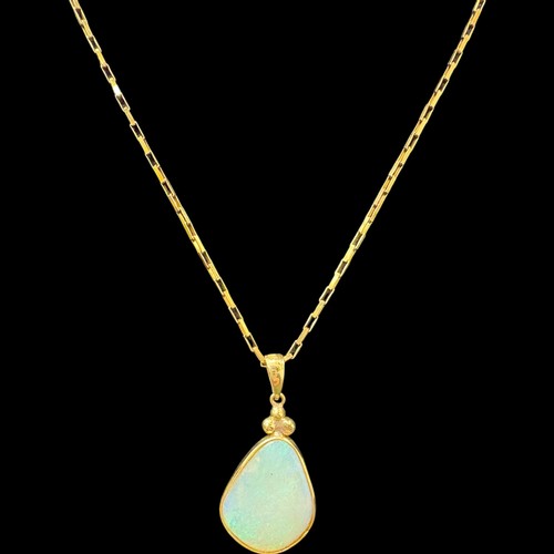 166 - 9ct gold opal pendant and chain. 4.8 Grams. Set with a 17.5 x 13.5mm crystal opal with good play of ... 