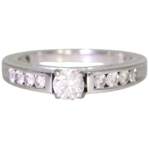 248 - An 18ct gold diamond single-stone ring with diamond set shoulders. Set with a principle brilliant cu... 